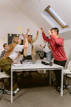 Young Professionals Celebrating In the Office