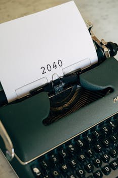 An Old Typewriter With 2040 Typed On Paper