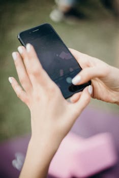 Person Using Black Iphone